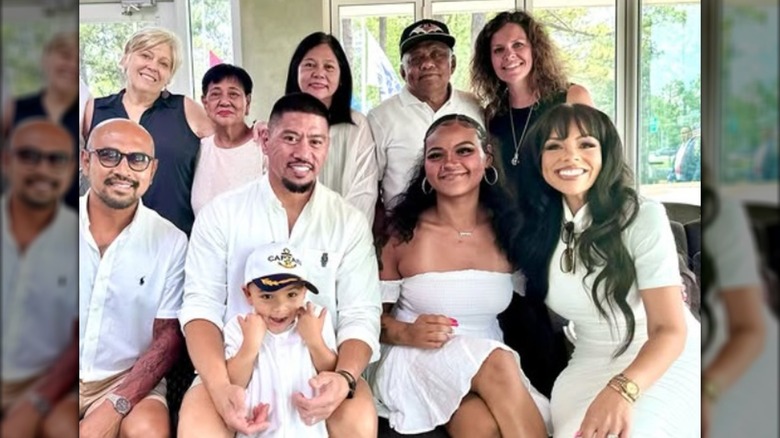 Alvin Lozano and Lauren Makk posing with family