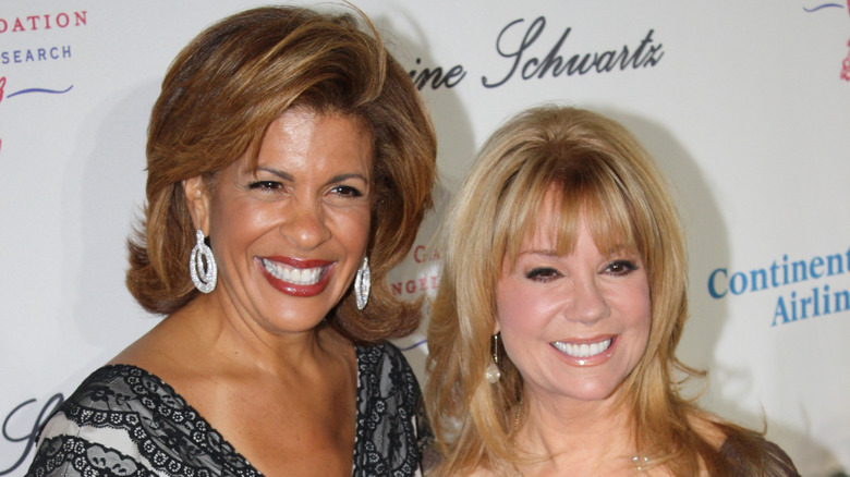 Hoda Kotb smiling next to Kathie Lee Gifford