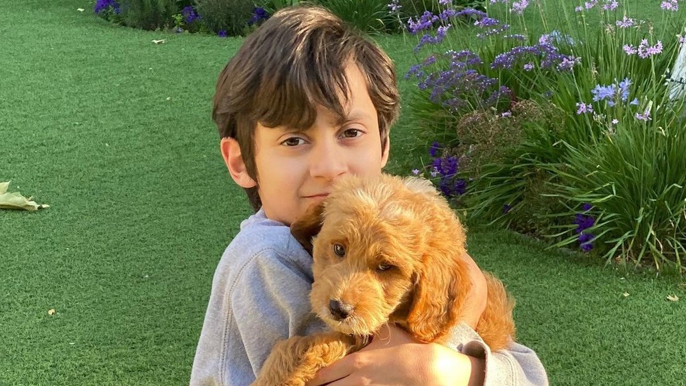 Maximilian Muniz with his dog, Tyson