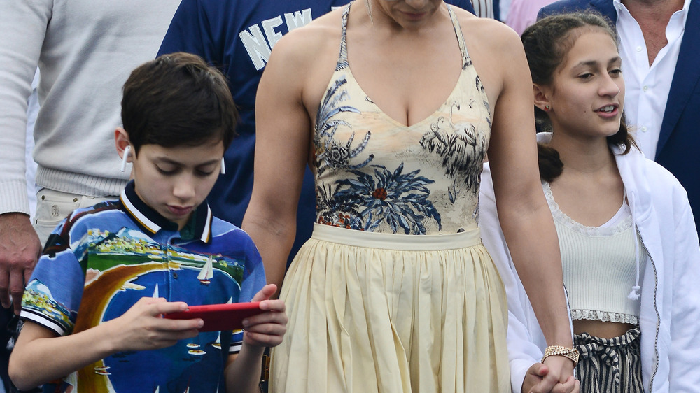 Max and Emme Muniz with their mother on the red carpet