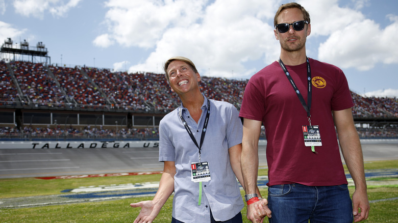 Jack McBrayer and Alexander Skarsgard holding hands