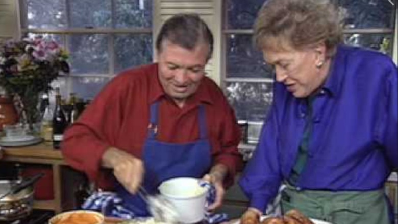 Julia Child and Jacques P﻿épin cooking together.