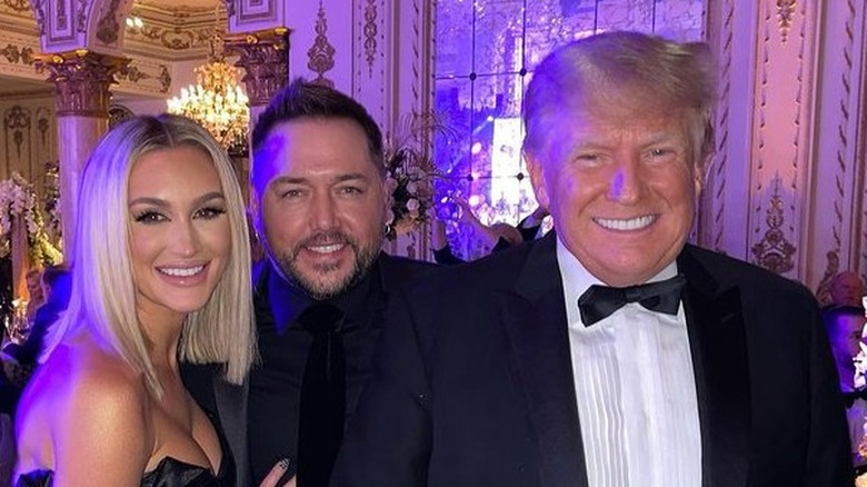 Jason Aldean, Brittany Aldean, and Donald Trump smiling 