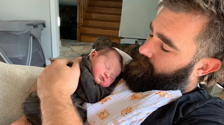 Jason Kelce holding newborn daughter