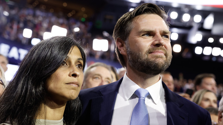 Usha Vance and husband JD Vance stand together