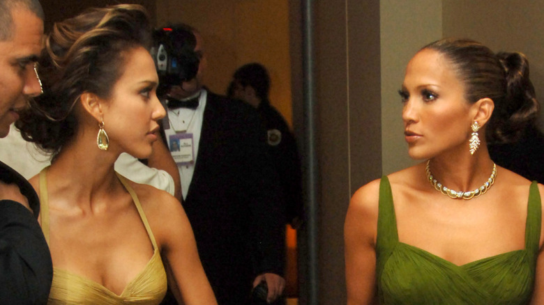 Jessica Alba and Jennifer Lopez looking at each other