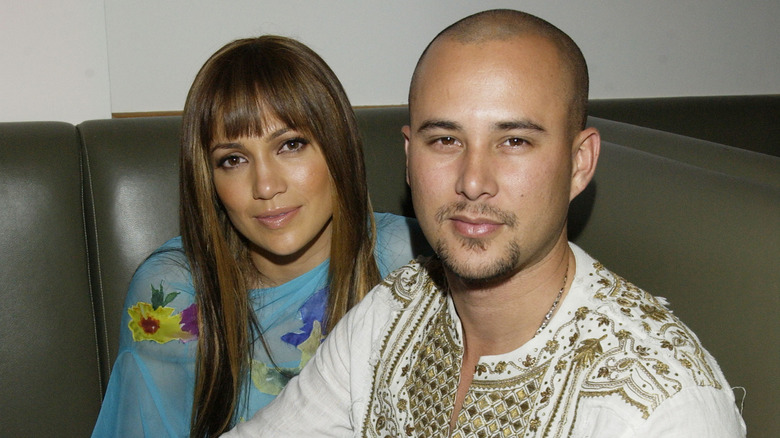 Jennifer Lopez and Cris Judd sitting together