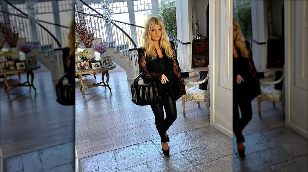 Jessica Simpson in front of the staircase in her home