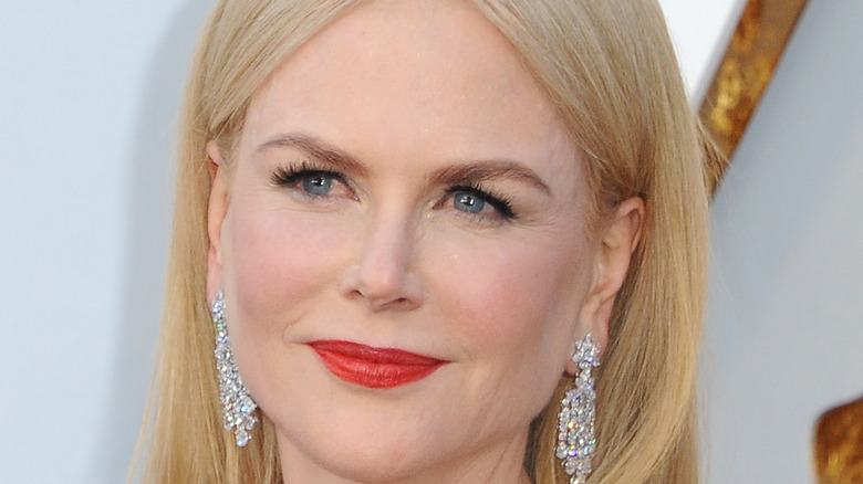 Nicole Kidman smiling while looking off to the side 