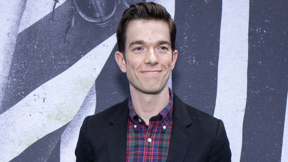 John Mulaney posing on the red carpet