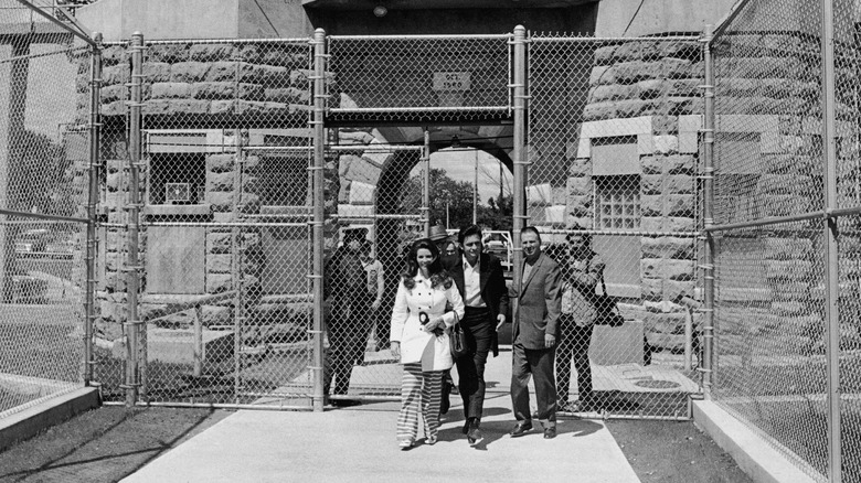 Johnny Cash and wife walking out of jail