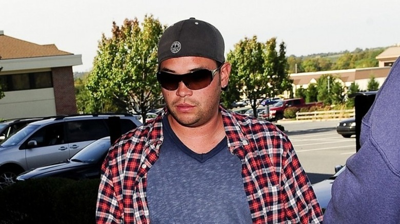 Jon Gosselin wearing cap and flannel shirt