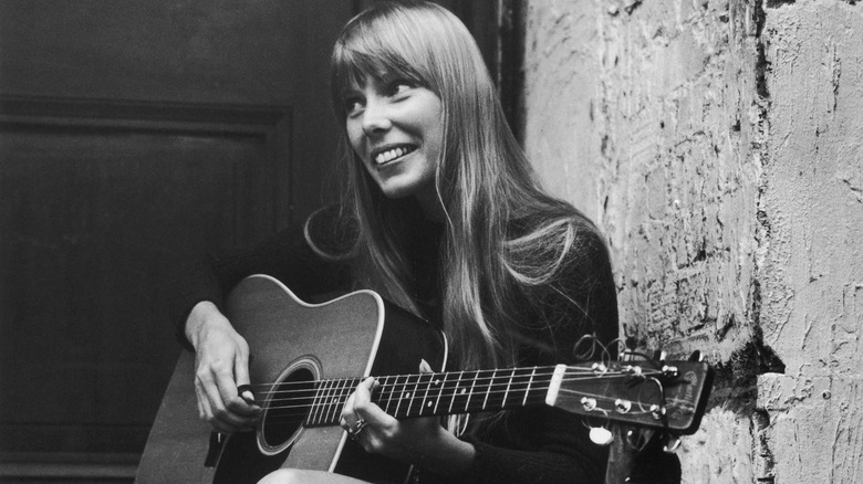 Very young Joni Mitchell with guitar