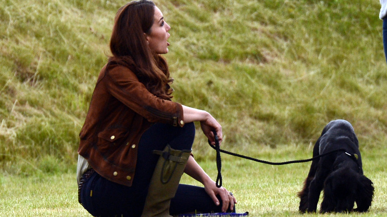 Catherine kneeling during dog walk