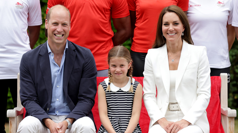 William, Kate, and Charlotte sitting and posing