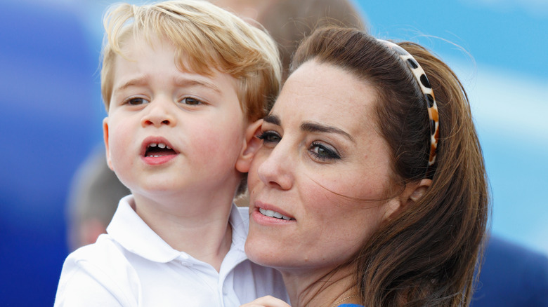 Kate Middleton carrying Prince George