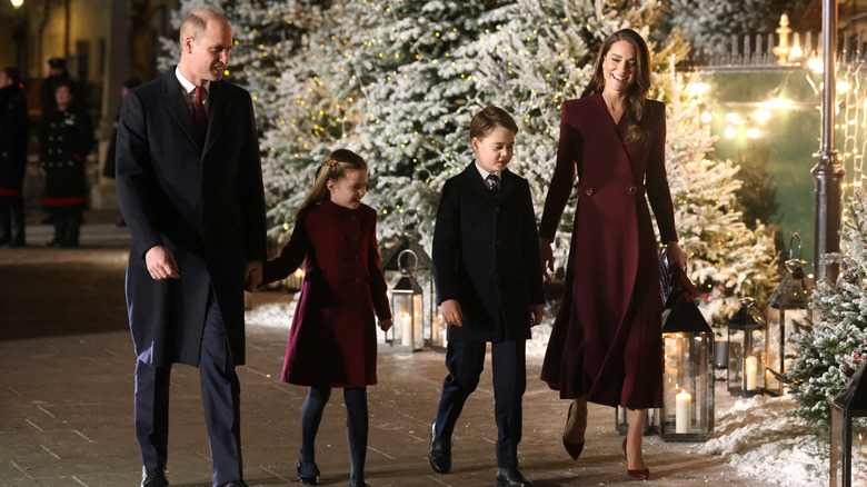 Prince William walking with Catherine, George, and Charlotte