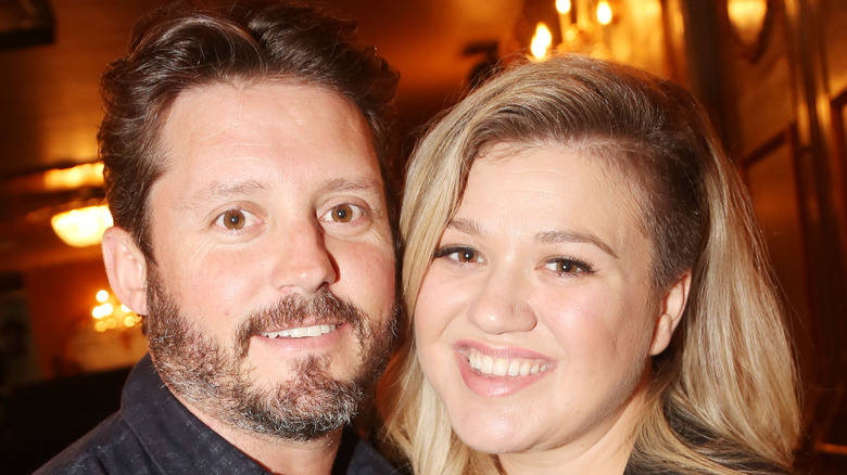 Kelly Clarkson and Brandon Blackstock side part