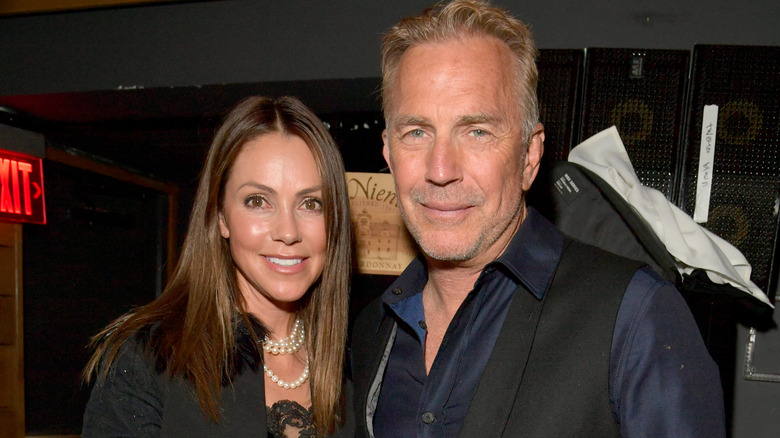 Christine Baumgartner and Kevin Costner posing 