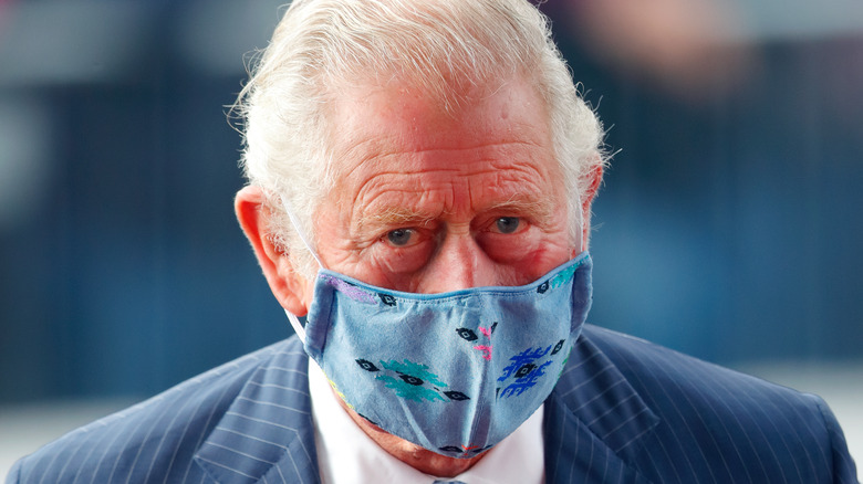 King Charles III wearing mask