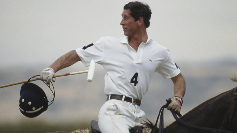 King Charles III playing polo