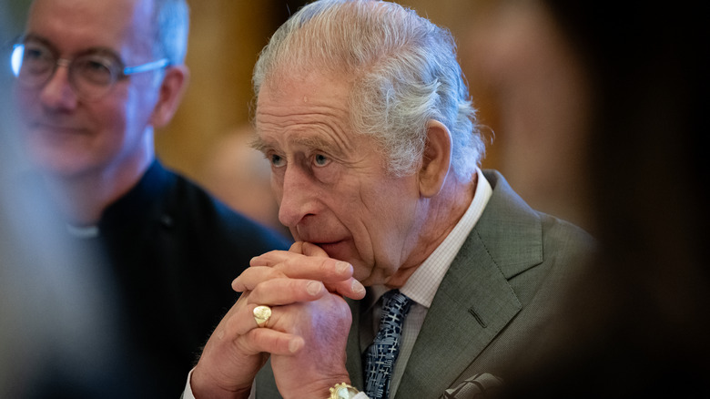 King Charles III thinking deeply