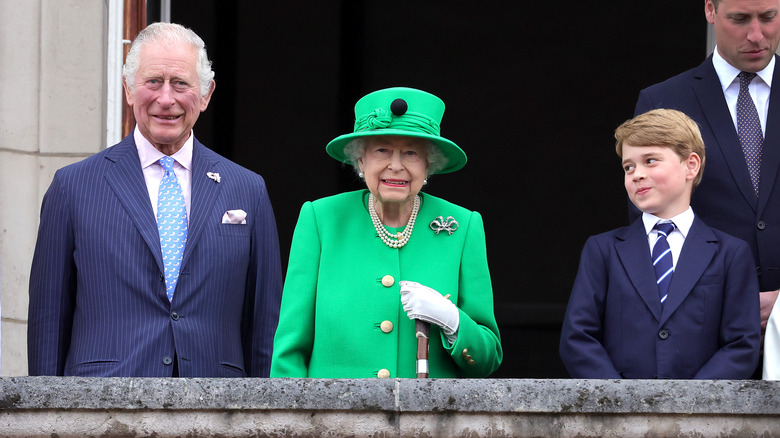 Prince Charles, Queen Elizabeth, and Prince George on balcony