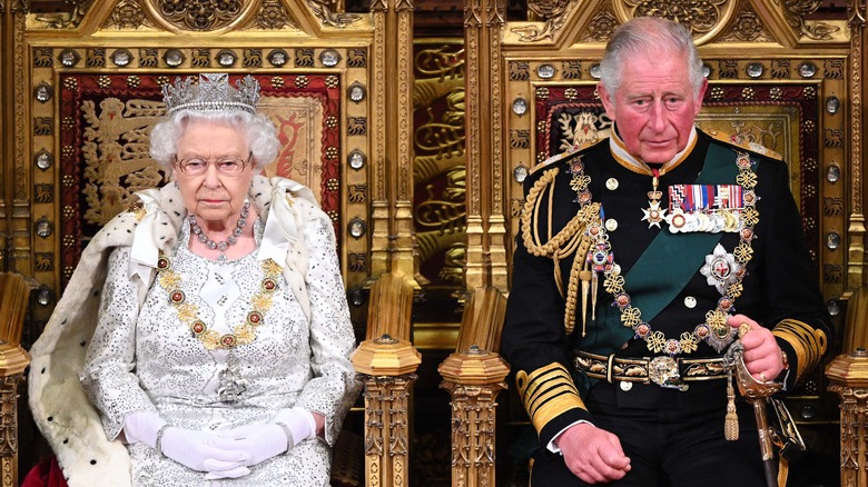 Queen Elizabeth on throne with Prince Charles