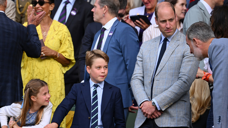 King Felipe talking with Prince William and children