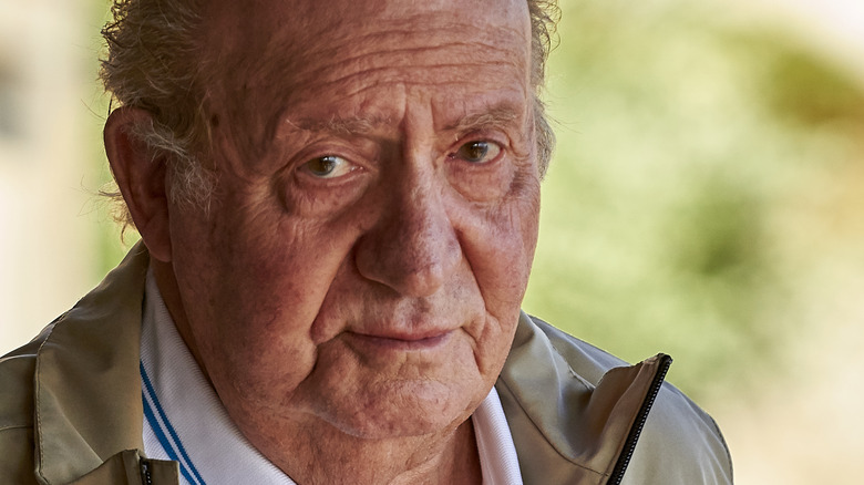 Former King Juan Carlos looks at camera