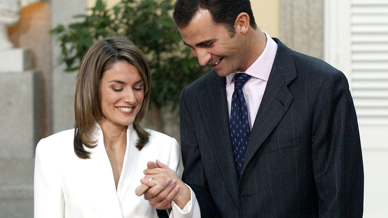 Letizia Ortiz and Prince Felipe look at Letizia's engagement ring