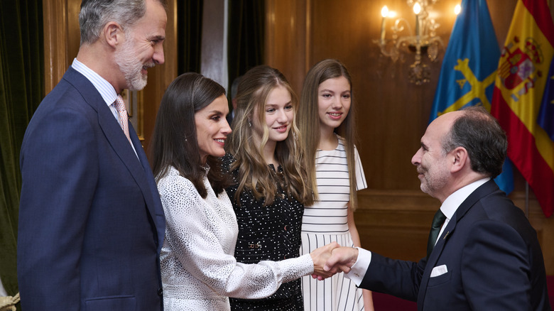 The Spanish royal family greet man