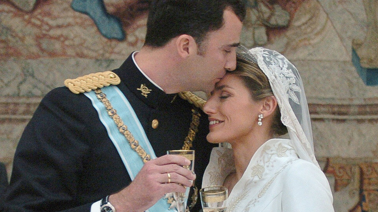 Prince Felipe embraces Princess Letizia at wedding