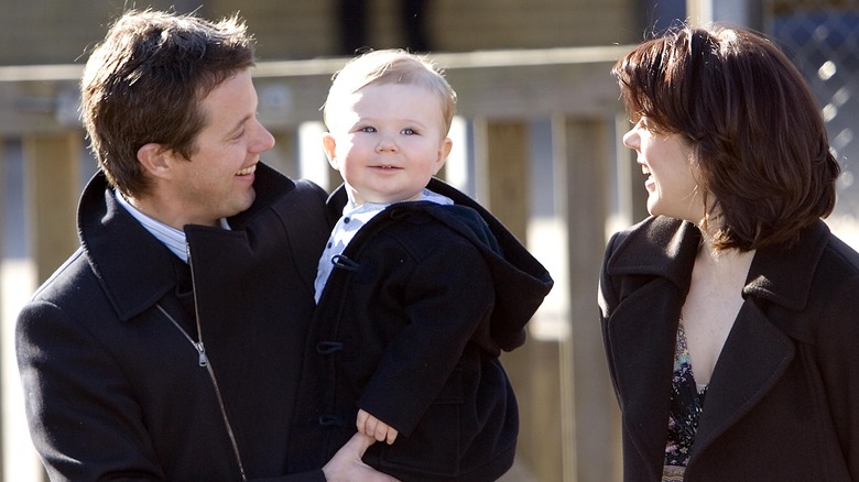 Young Prince Christian, King Frederik, and Queen Mary waving