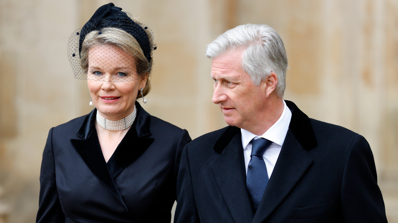 Queen Mathilde and King Philippe walking