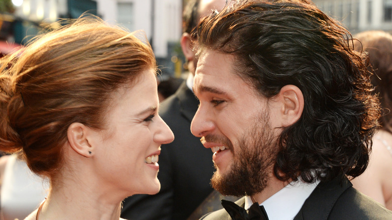 Kit Harington and Rose Leslie looking endearingly at each other