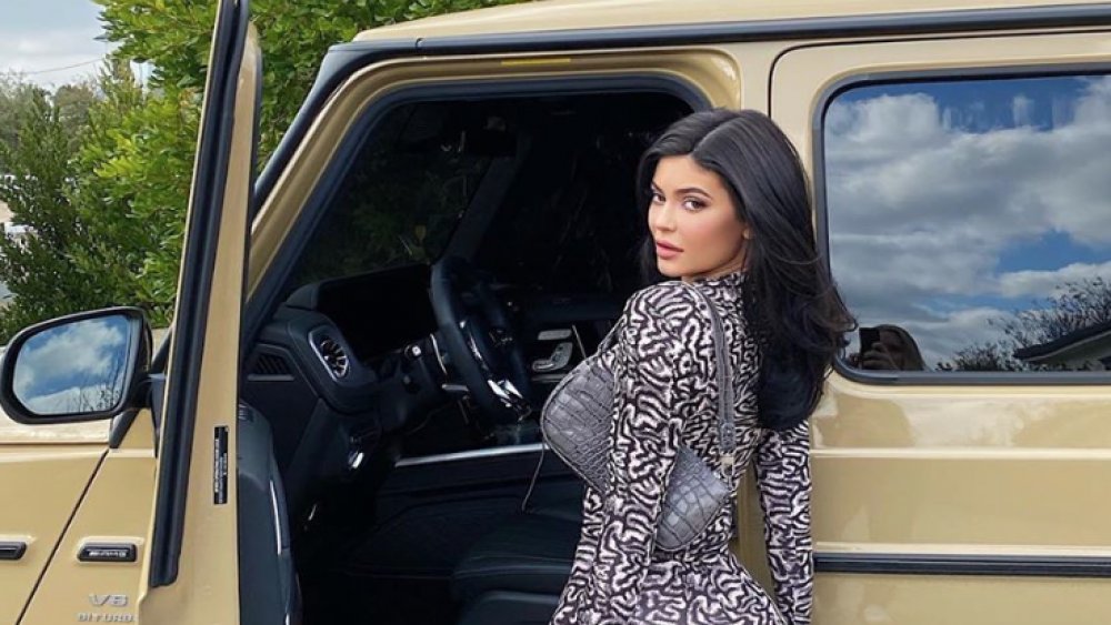 Kylie Jenner by a car