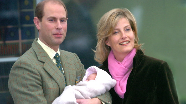 Prince Edward and Sophie, Duchess of Edinburgh, holding Lady Louise 