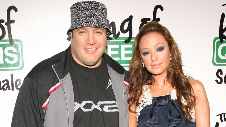 Kevin James and Leah Remini posing