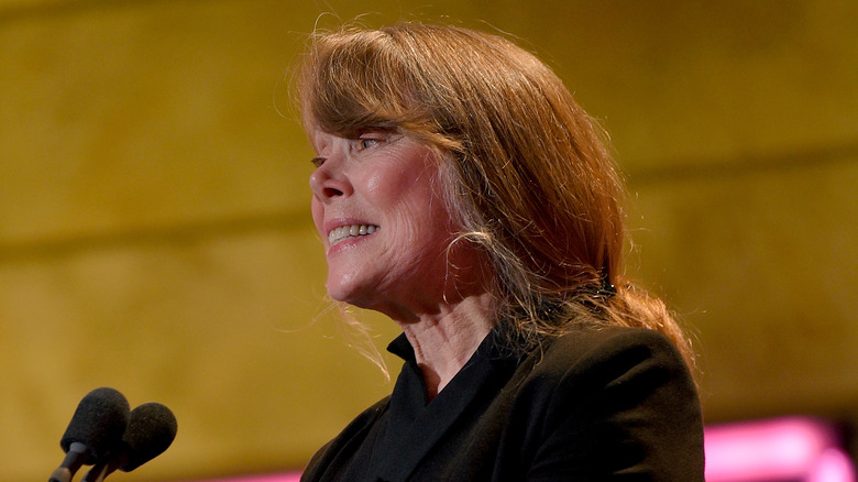 Sissy Spacek standing at microphone