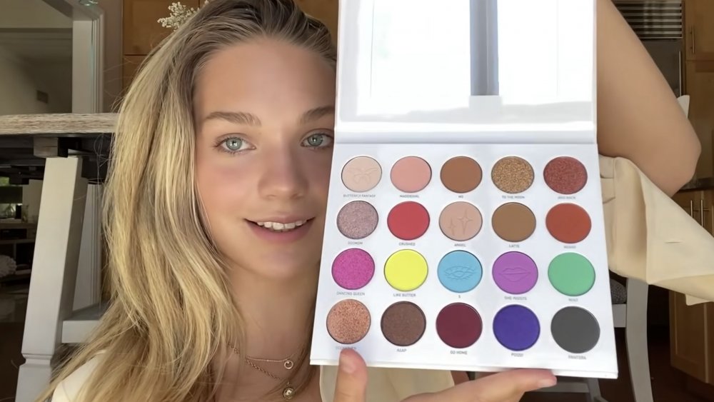 Maddie Ziegler holding her Morphe makeup palette