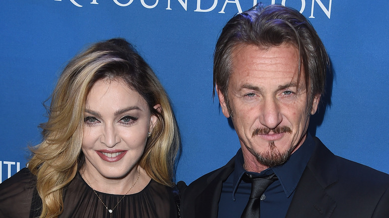 Sean Penn and Madonna posing for photos