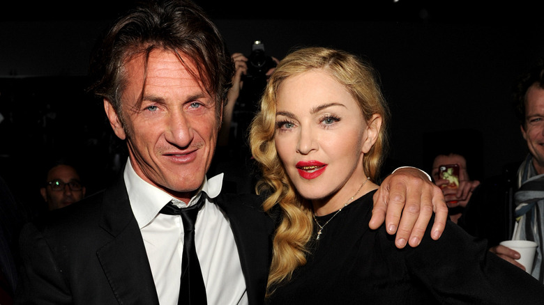 Sean Penn and Madonna posing for photos