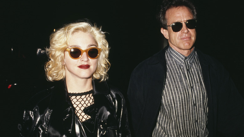 Madonna and Warren Beatty wearing sunglasses