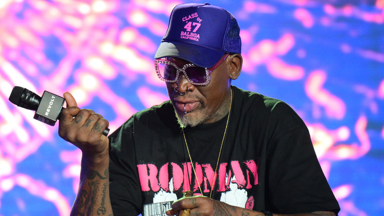 Dennis Rodman holding mic on stage