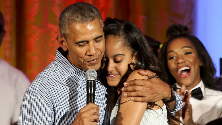 Malia Obama hugging her dad Barack