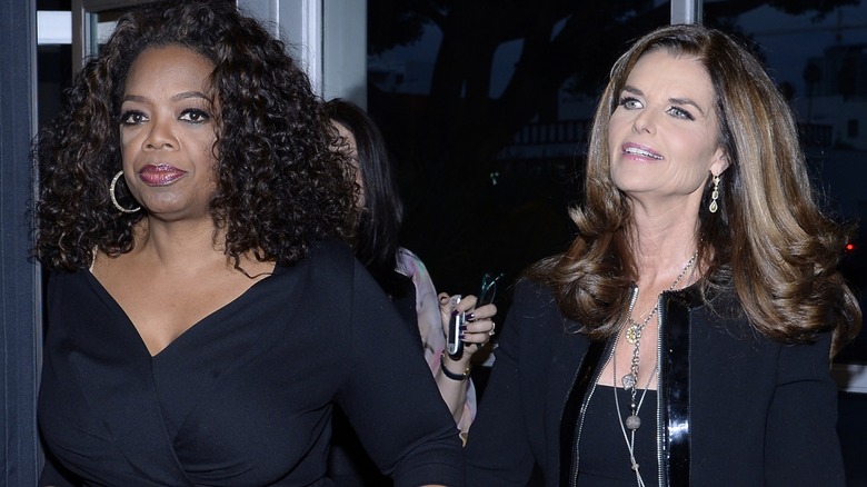 Maria Shriver and Oprah Winfrey walking together