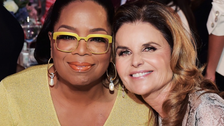 Maria Shriver and Oprah Winfrey smiling