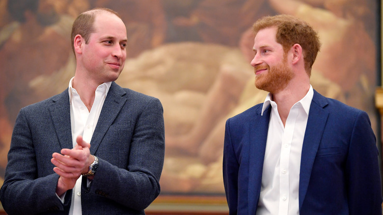 Prince William and Prince Harry look at each other