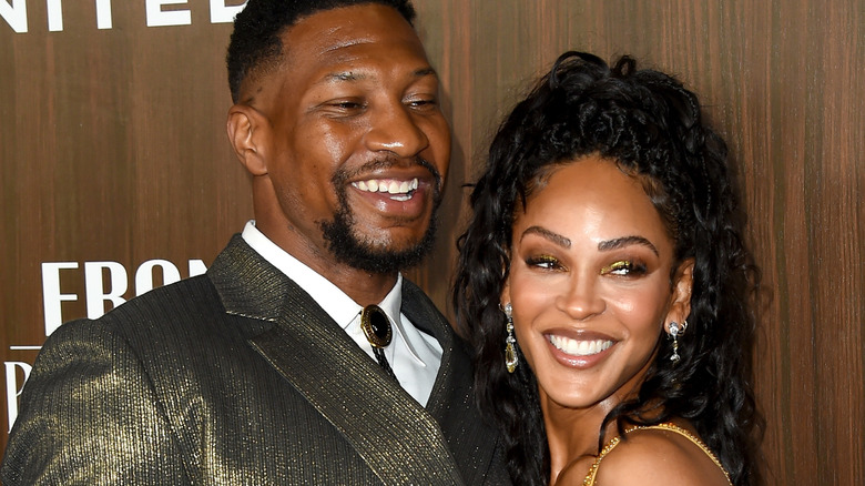 Jonathan Majors and Meagan Good smiling